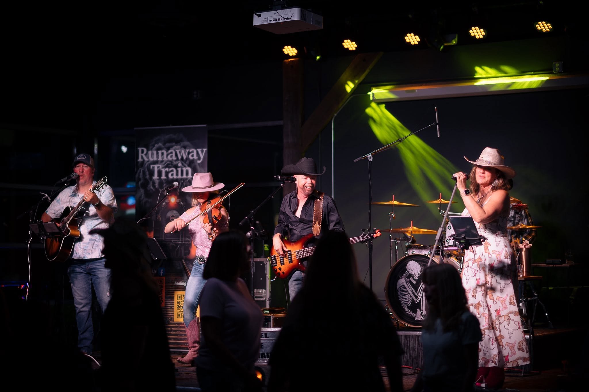 Runaway Train full band performing on stage